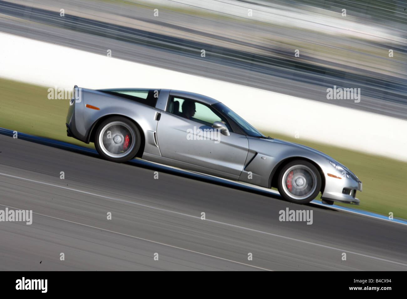 Corvette Z06, model year 2006-, silver, driving, side view, test track Stock Photo