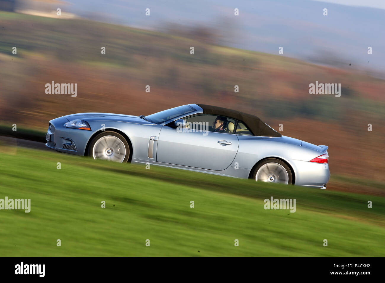 Jaguar XKR Convertible, model year 2006-, silver, driving, side ...