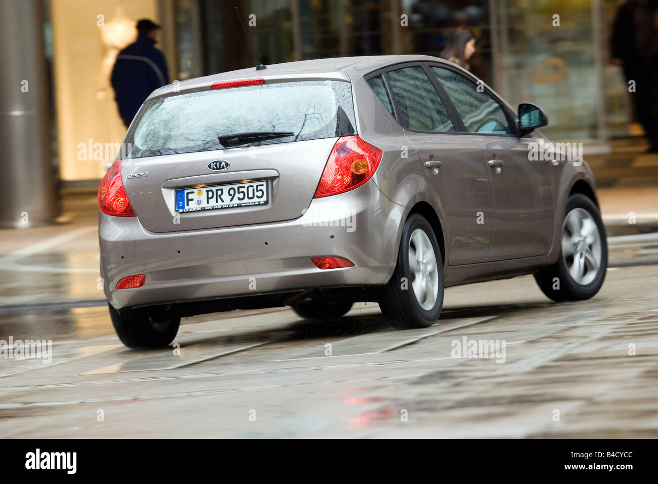 Kia Cee'd 1.4 CVVT EX, model year 2007-, anthracite, driving, moving,  diagonal from the back, rear view, City Stock Photo - Alamy