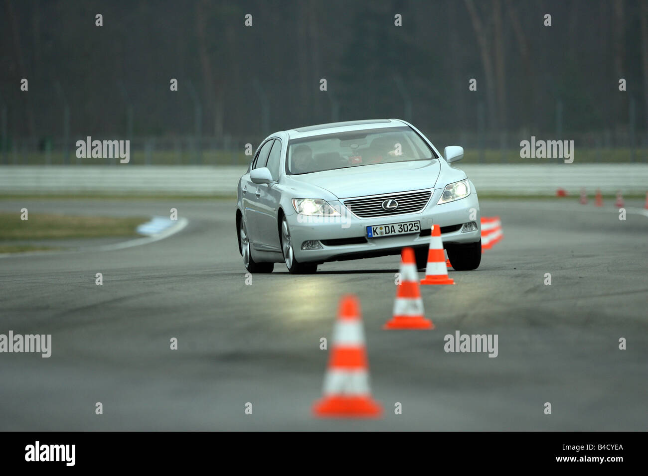 Lexus LS 460 Ambience Impression, model year 2007-, white, driving, diagonal from the front, frontal view, Pilonen, test track Stock Photo