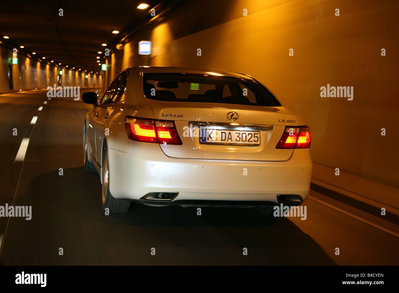Lexus LS 460 Ambience Impression, model year 2007-, white, driving, diagonal from the back, rear view, City, Tunnel Stock Photo