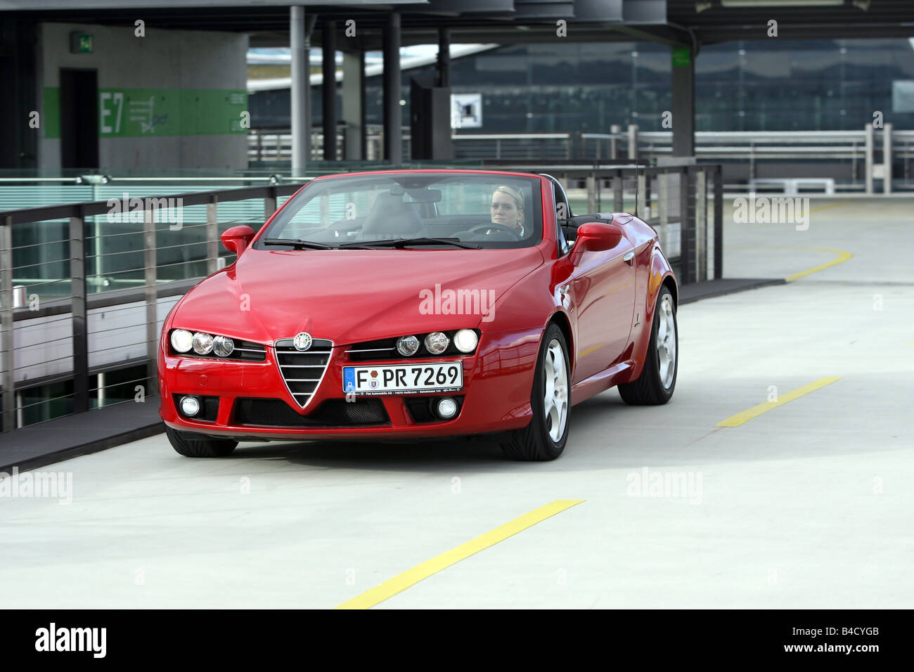 Alfa Romeo Spider 2.2 JTS Exclusive, model year 2007-, red, driving, diagonal from the front, frontal view, open top Stock Photo