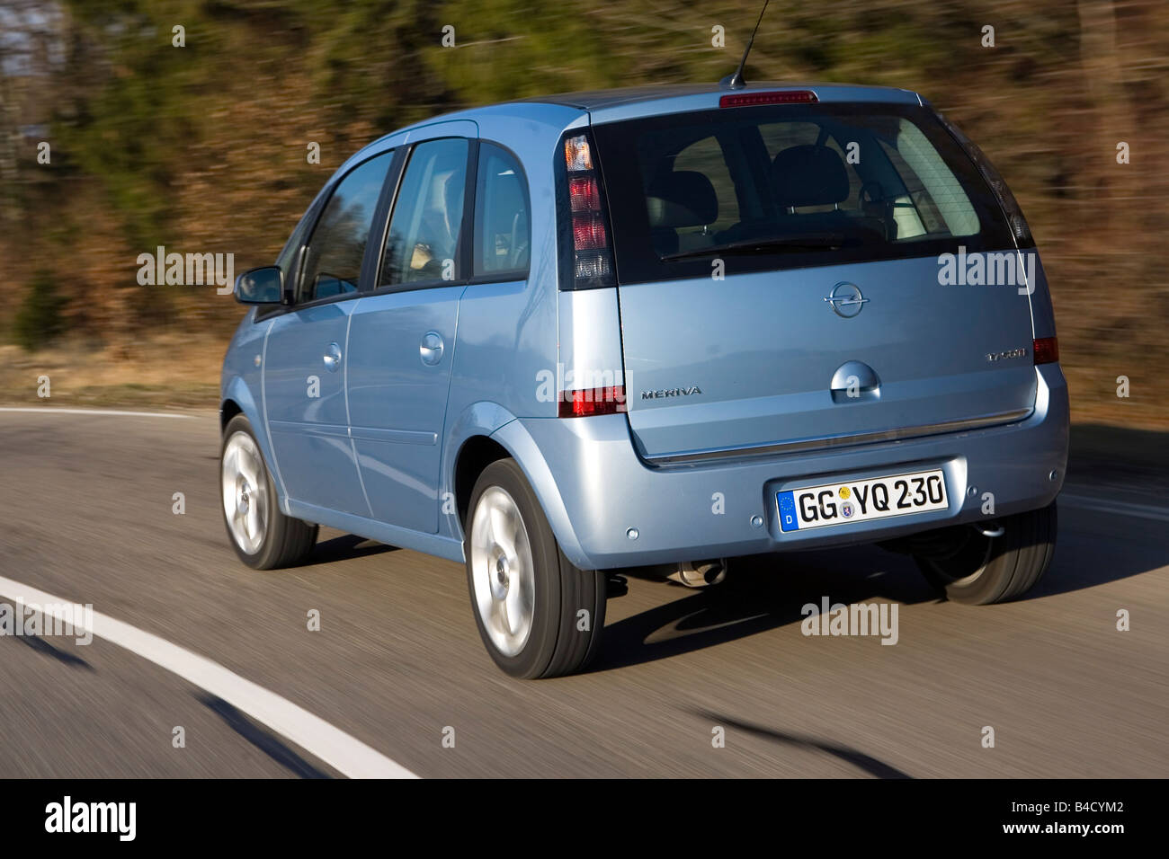 Opel Meriva 1.7 CDTi, model year 2007-, silver, driving, diagonal from the  back, rear view, country road Stock Photo - Alamy