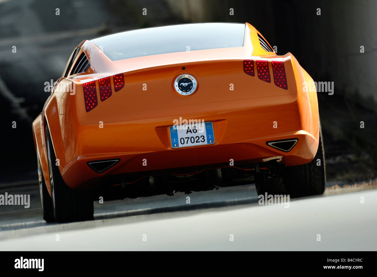 Ford Mustang by Giugiaro, model year 2007, orange -metallic, standing, upholding, rear view Stock Photo