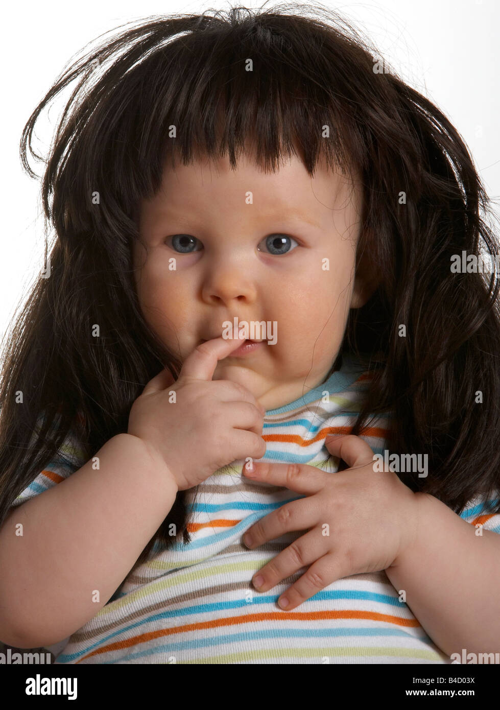 Baby boy with woman's wig Stock Photo Alamy