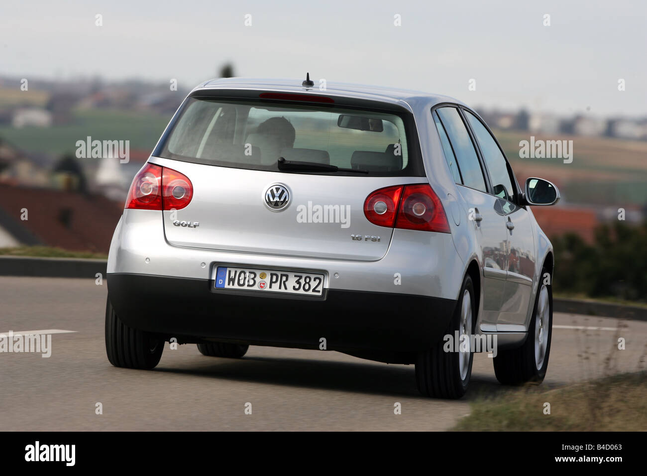 VW Volkswagen Golf 1.6 FSI Comfortline, model year 2005-, silver, driving,  diagonal from the back, rear view, country road Stock Photo - Alamy