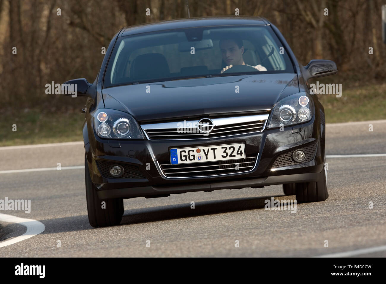 Opel Astra 1.6 Turbo Cosmo, model year 2007-, driving, frontal view,  country road Stock Photo - Alamy