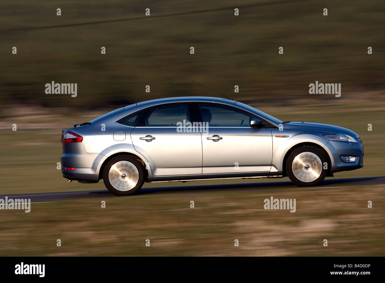 Ford Mondeo 2.5 T, model year 2007-, silver, driving, side view, country road Stock Photo
