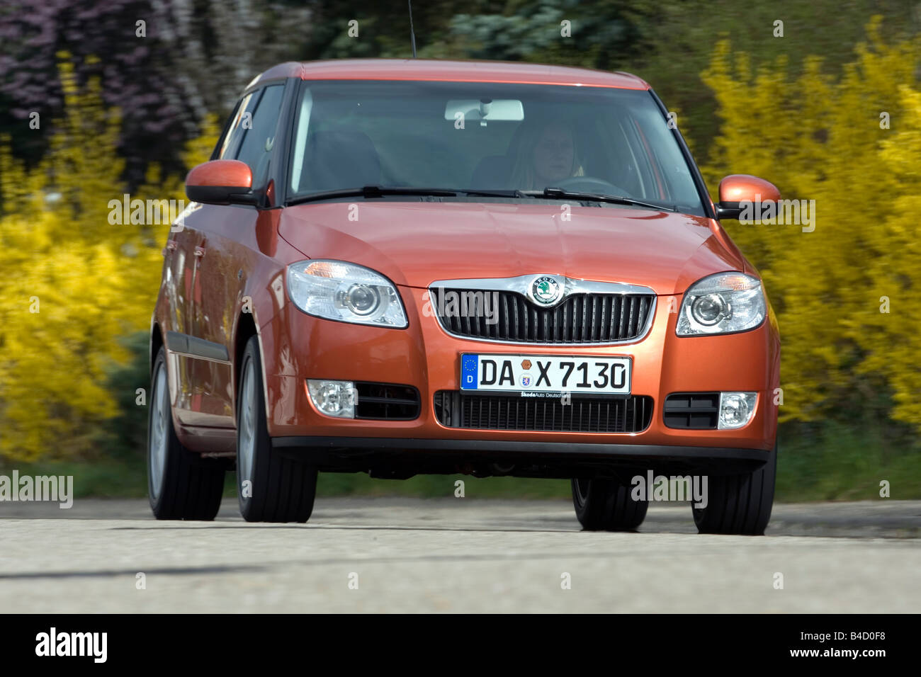 Skoda Fabia 1.4 16V Sport, model year 2007-, orange , driving, diagonal  from the front, frontal view, country road Stock Photo - Alamy