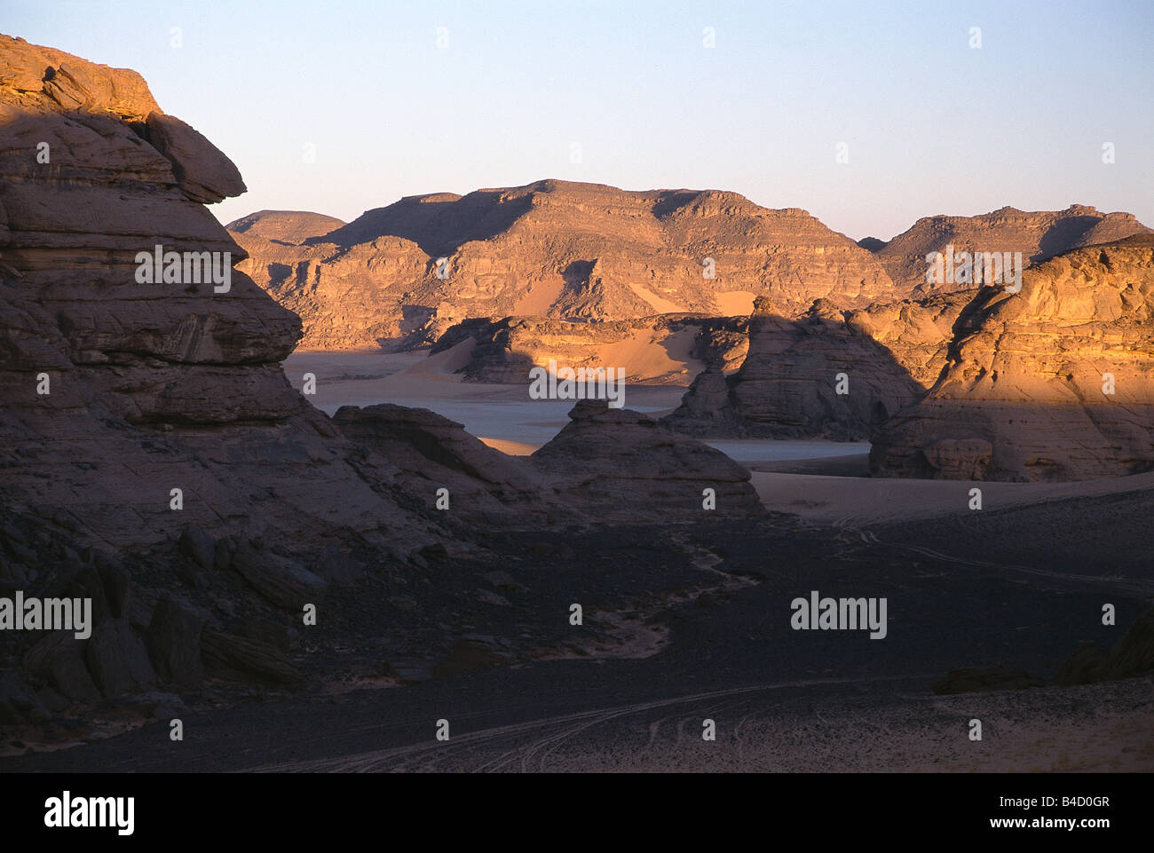 Empty valleys and rocky mountains at Jebel Acacus, Sahara Desert, Libya. Stock Photo