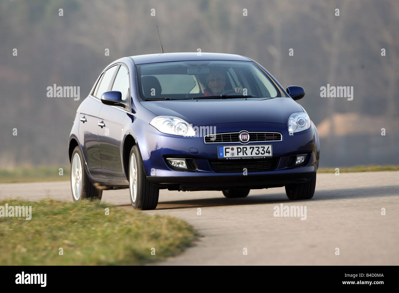Fiat Bravo 1.9 Multijet 16V Emotion, model year, 2007-, dunkelblue moving, diagonal from the front, frontal view, country road Stock Photo