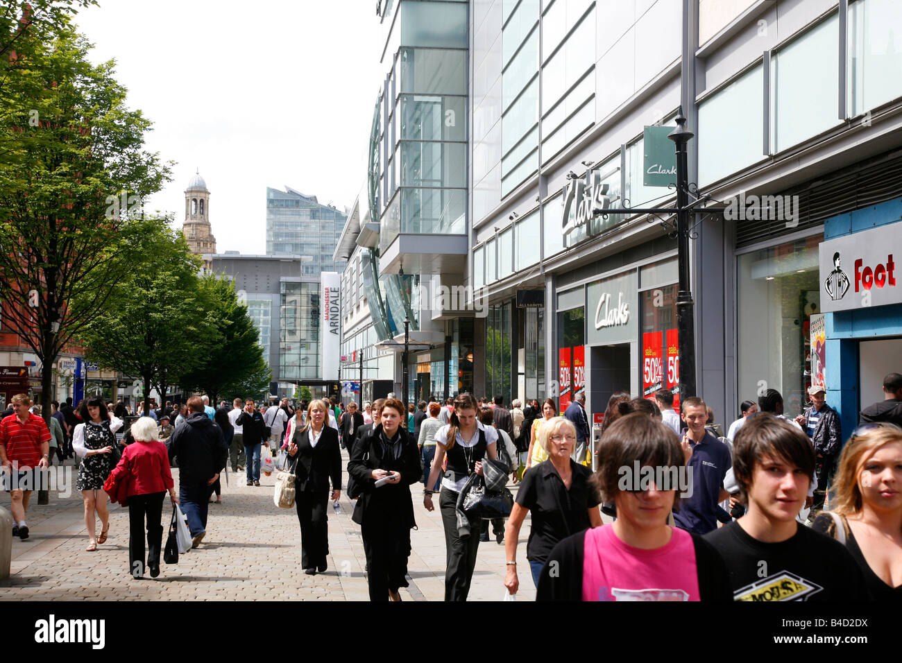 Aug 2008 - People walking along the Market street with many shops Manchester England UK Stock Photo