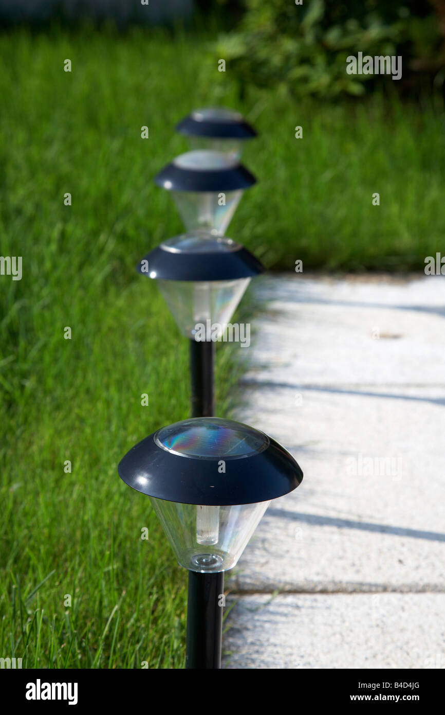 solar garden lighting being used to light pathway in garden in the uk Stock Photo