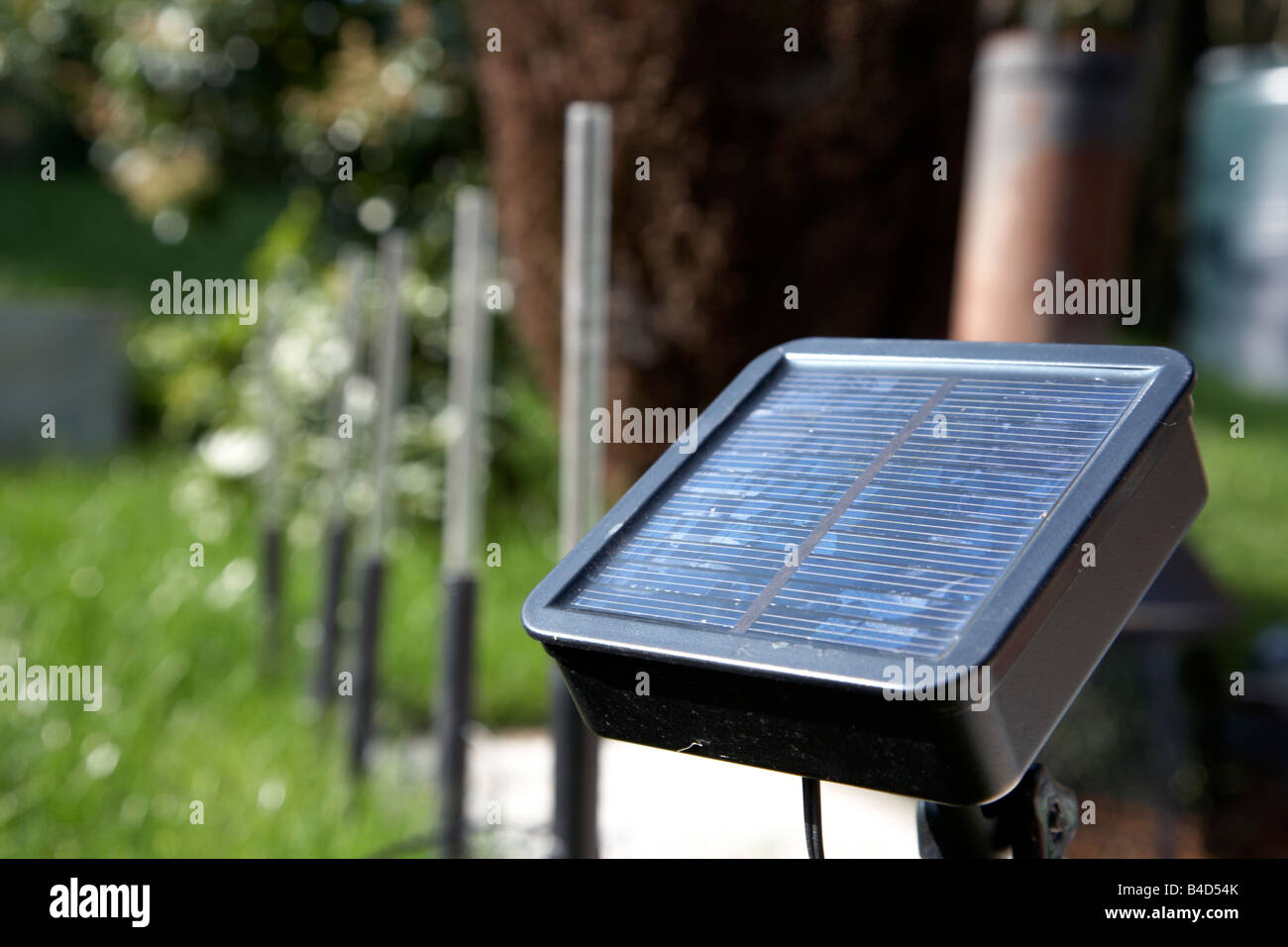 solar garden lighting being used to light pathway in garden in the uk Stock Photo