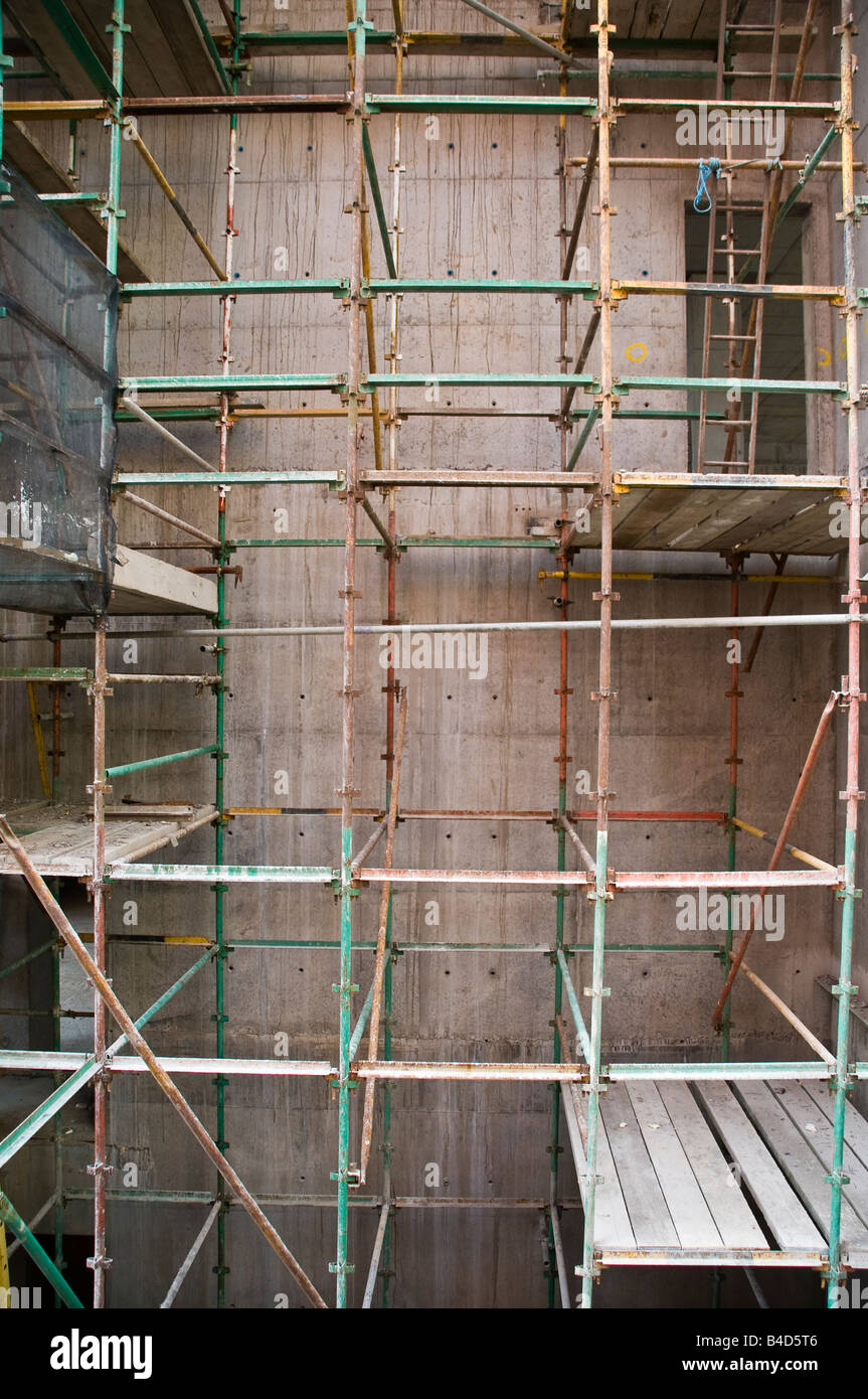 Scaffolding used in the construction of a concrete building Stock Photo