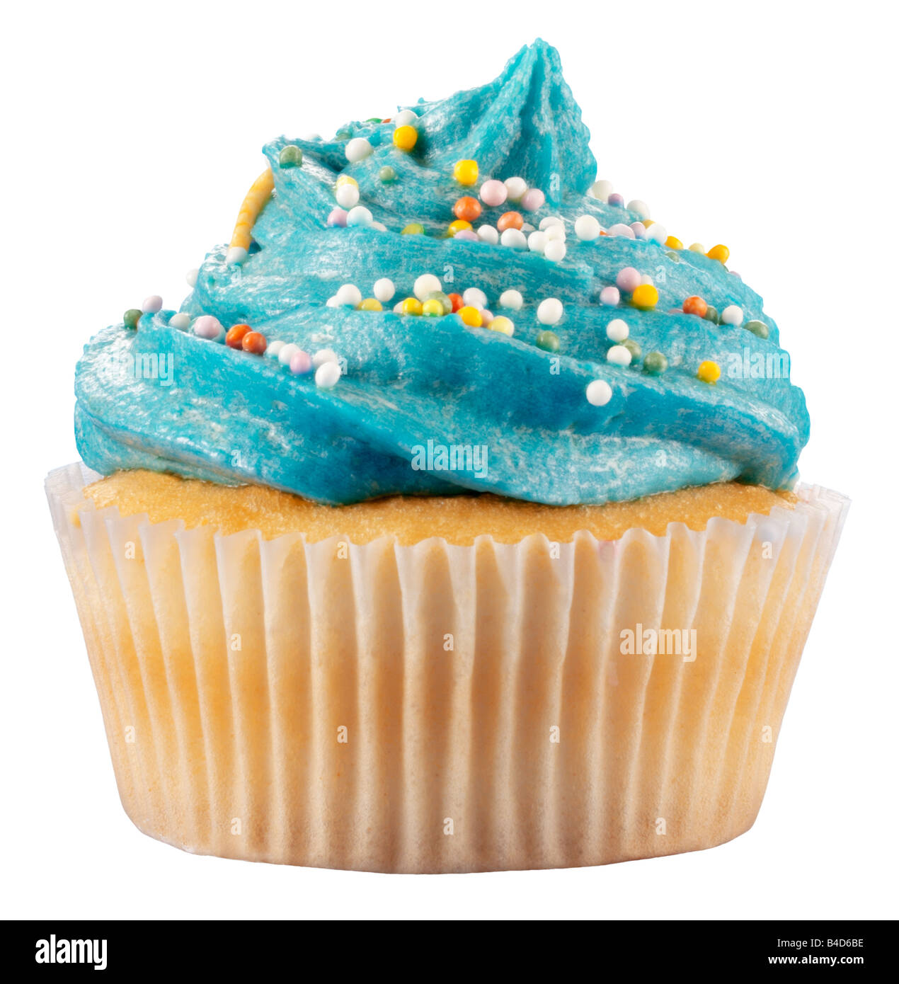 CUPCAKE WITH BLUE FROSTING ON WHITE Stock Photo