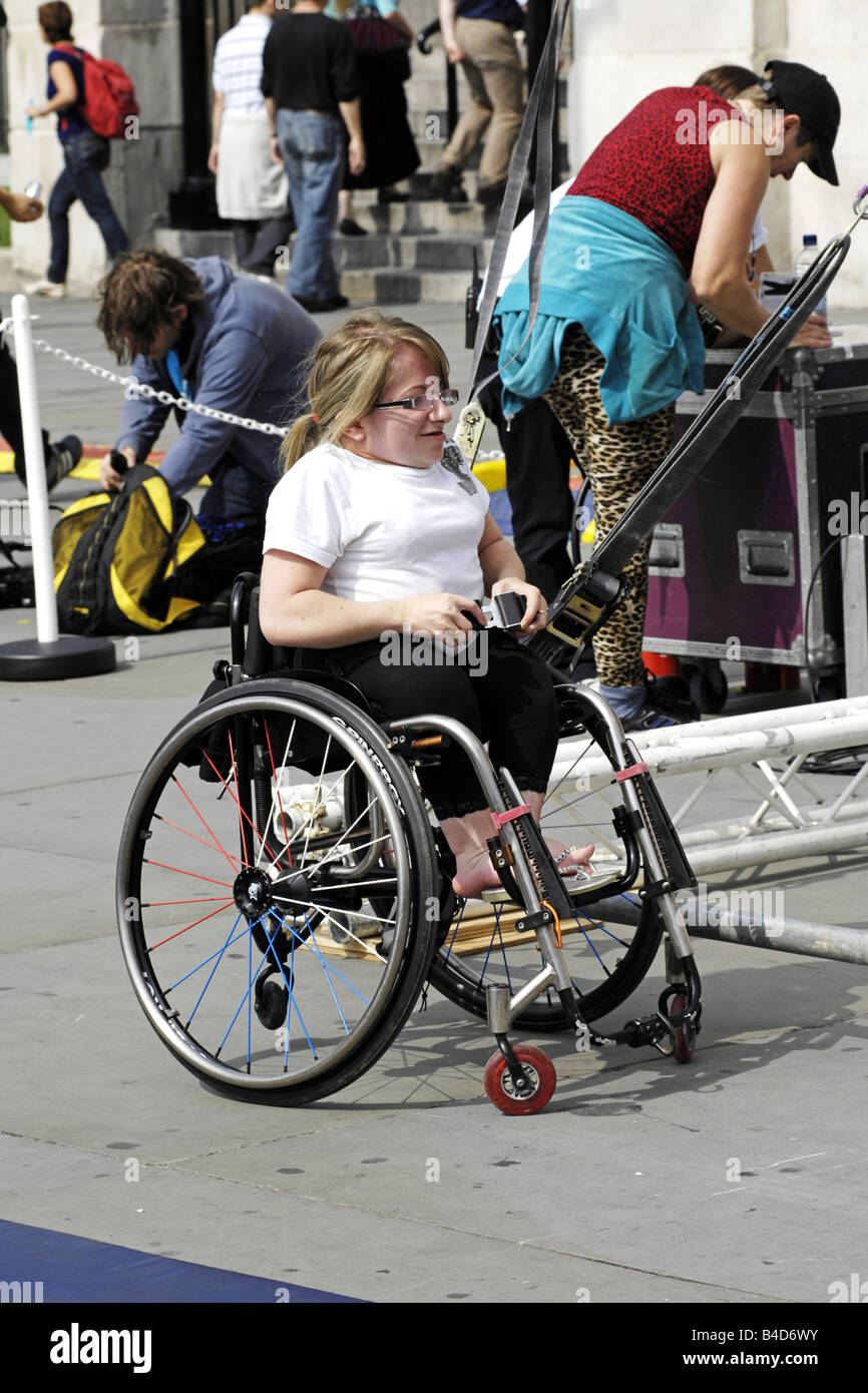 Dwarf in a wheelchair at the Liberty Festival London Stock Photo Alamy