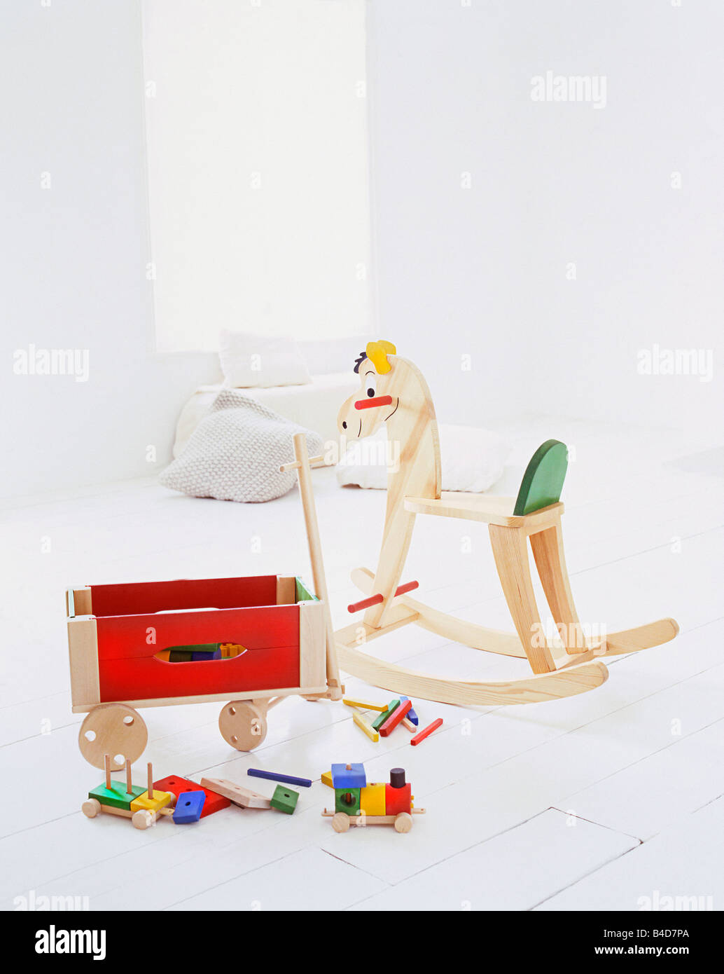 traditional wooden toys in a white room Stock Photo