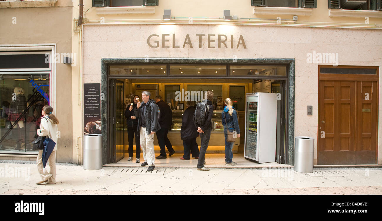 Gelateria shop, tourists enjoying gelato ice cream, Verona, Italy Stock Photo