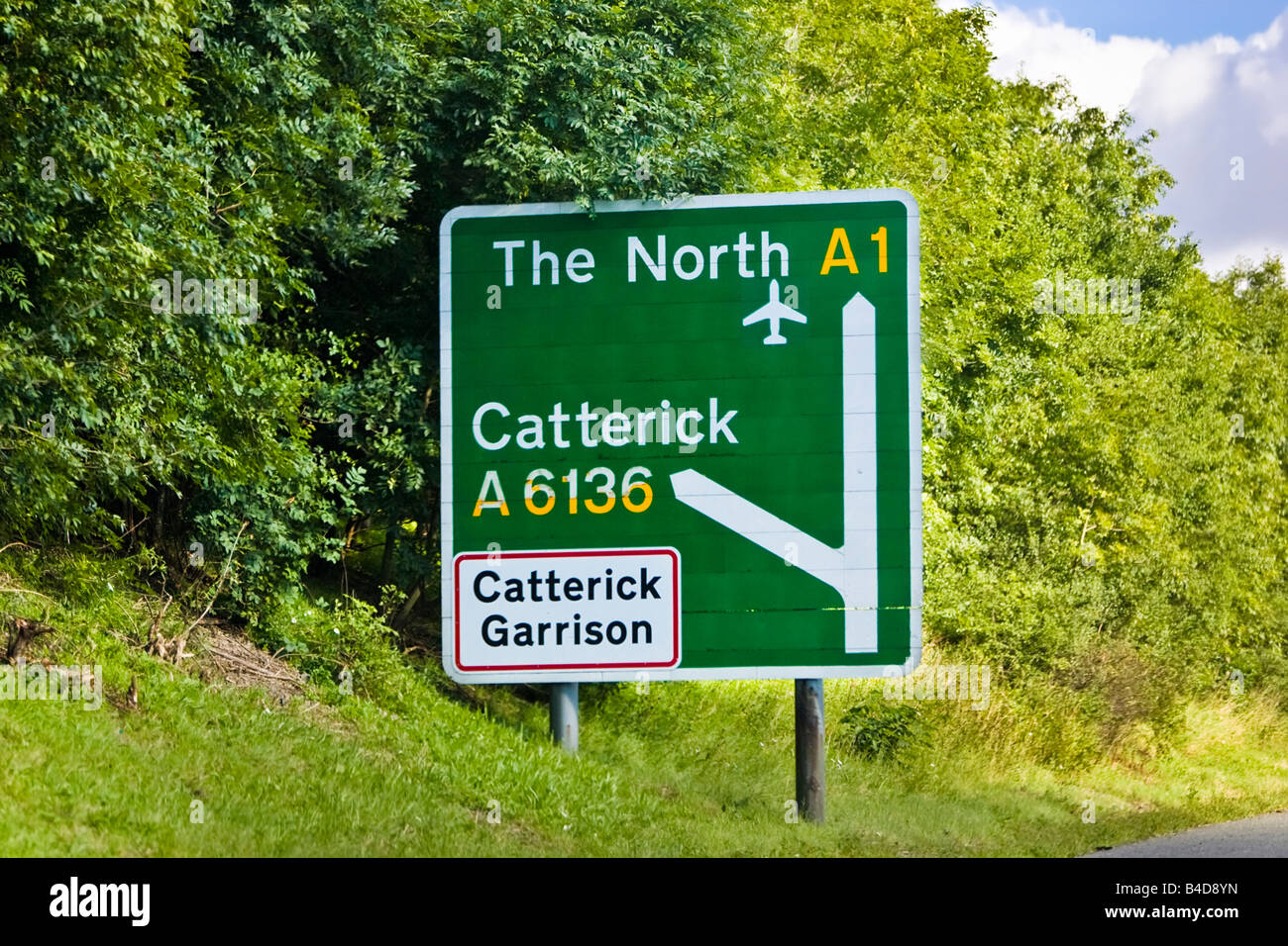 A Green Road Primary Route Traffic Sign With Junction Information Stock Photo Alamy