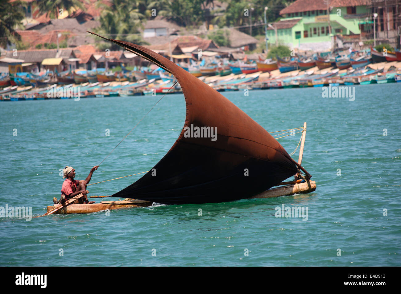 indian fisherman sailing a canoe Stock Photo