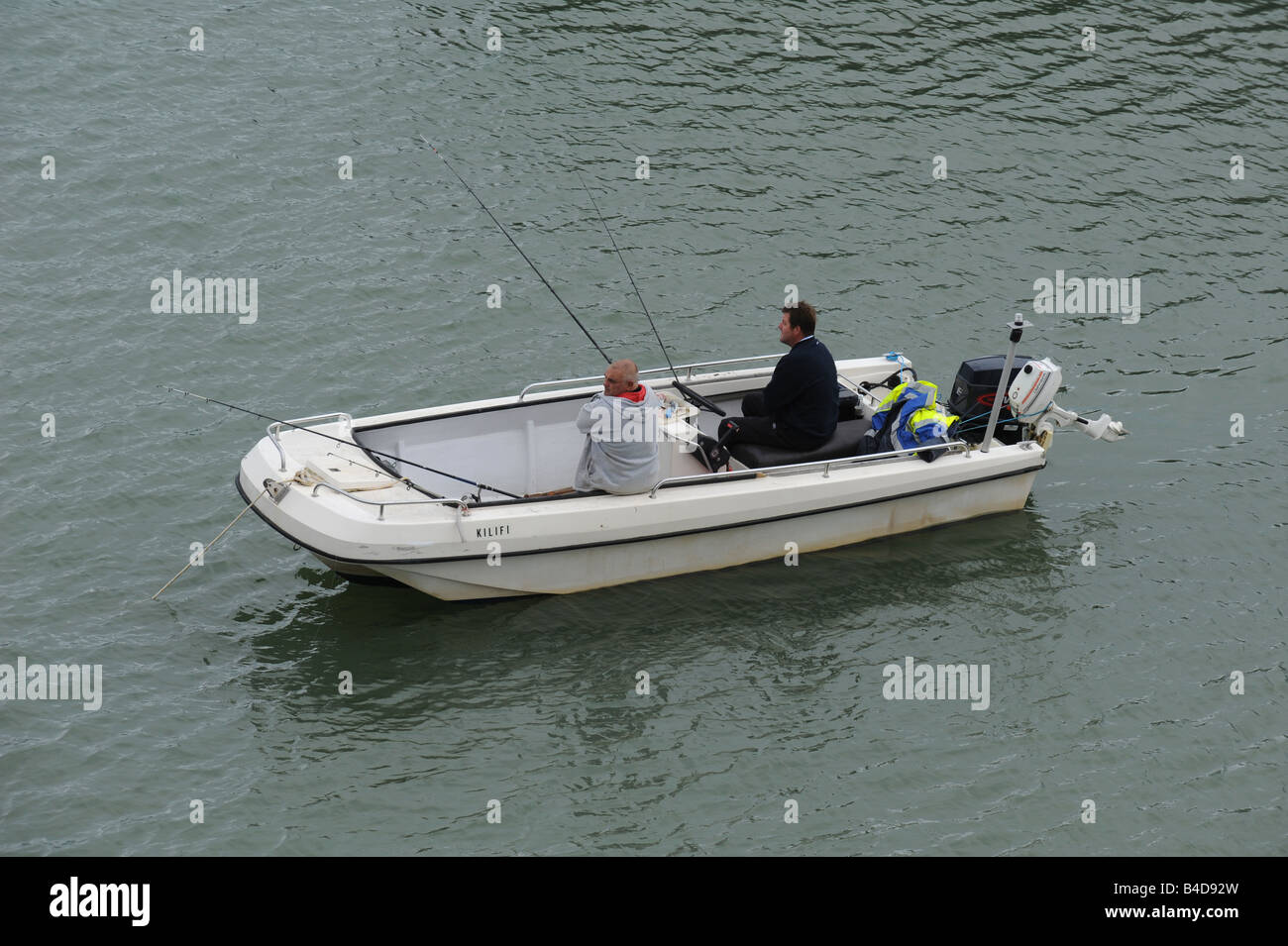 Two men fishing in motor boat hi-res stock photography and images - Alamy