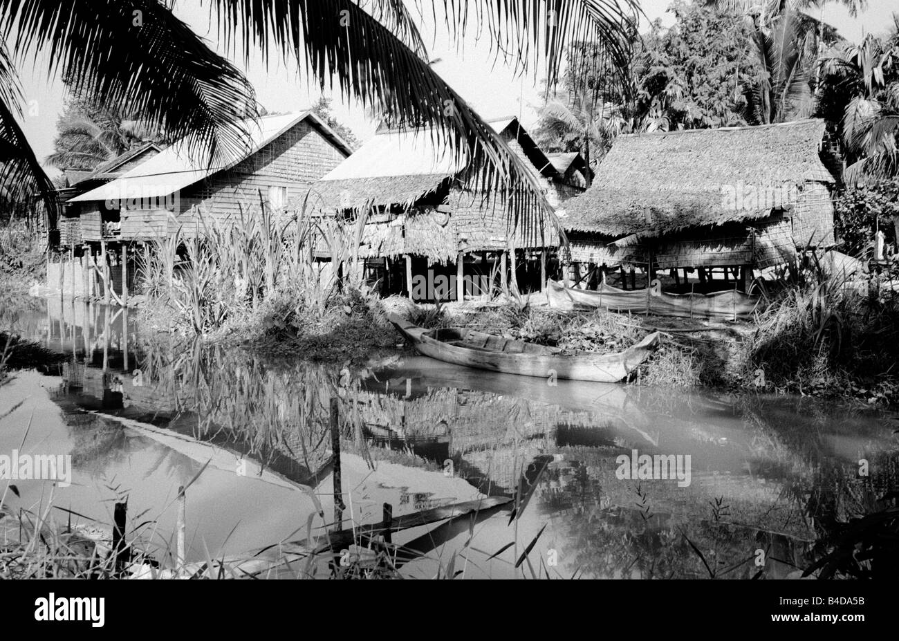 Jan 20, 2003 - Bamboo huts near Phnom Krom at Tonle Sap lake outside the Cambodian town of Siem Riep. Stock Photo