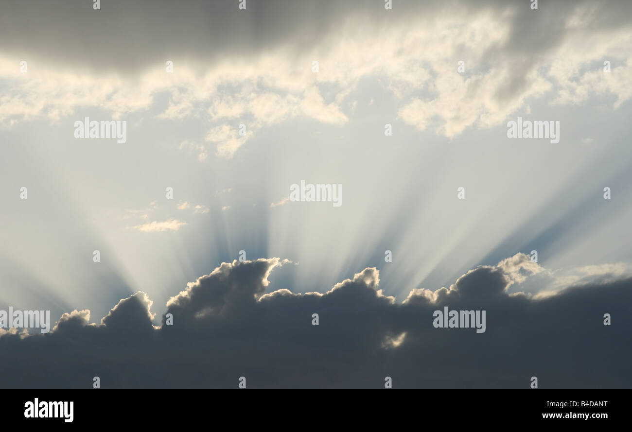 Sunset cloudscape: background with sunbeams and clouds in the sky Stock ...