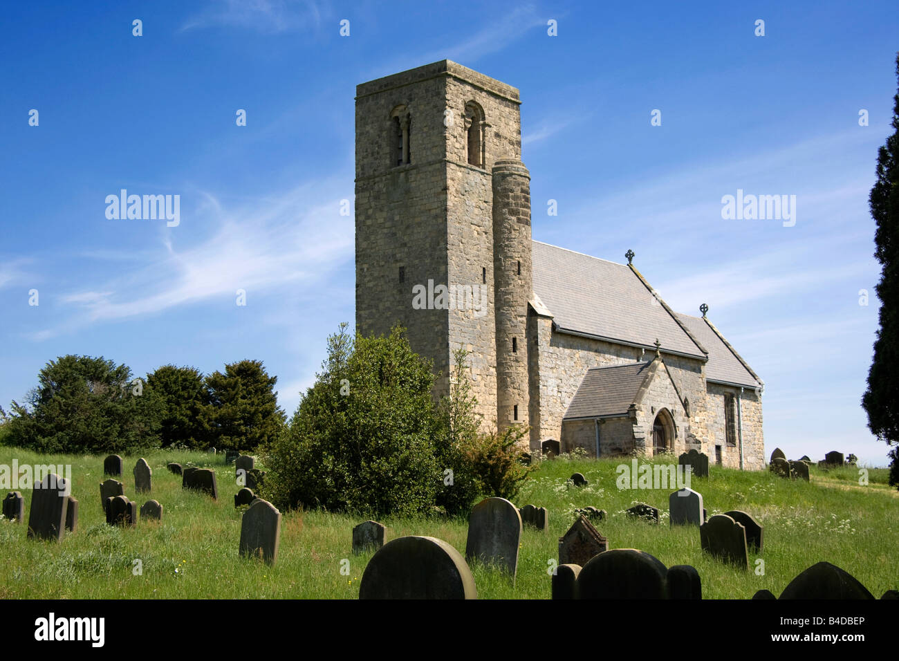 A country church and graveyard Stock Photo