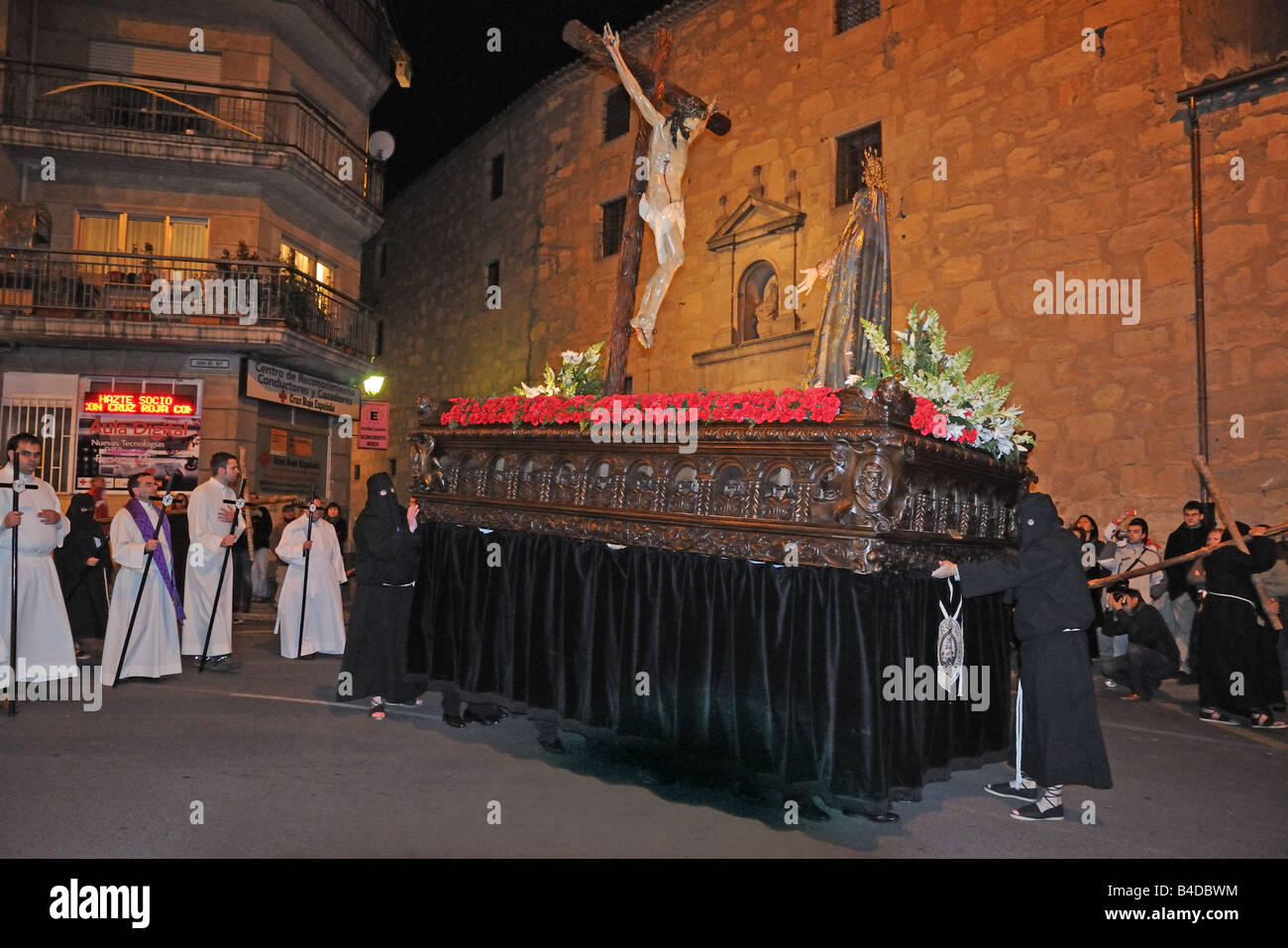 Night time Semana Santa Holy Week Easter procession passing Convent de la Madre de Dios Salamanca Spain Stock Photo