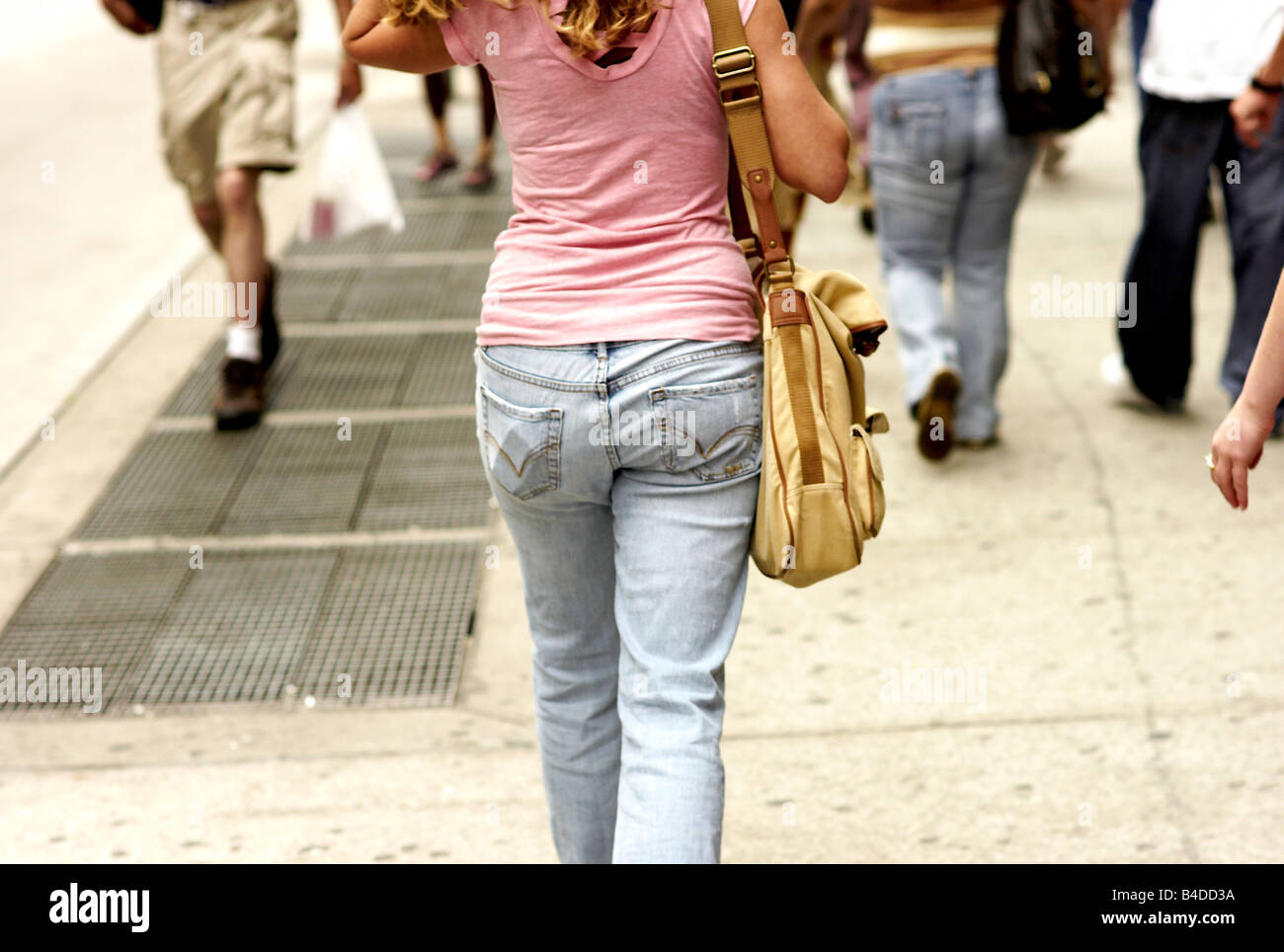 A woman walks down the street in Manhattan in faded jeans nice ass Stock  Photo - Alamy