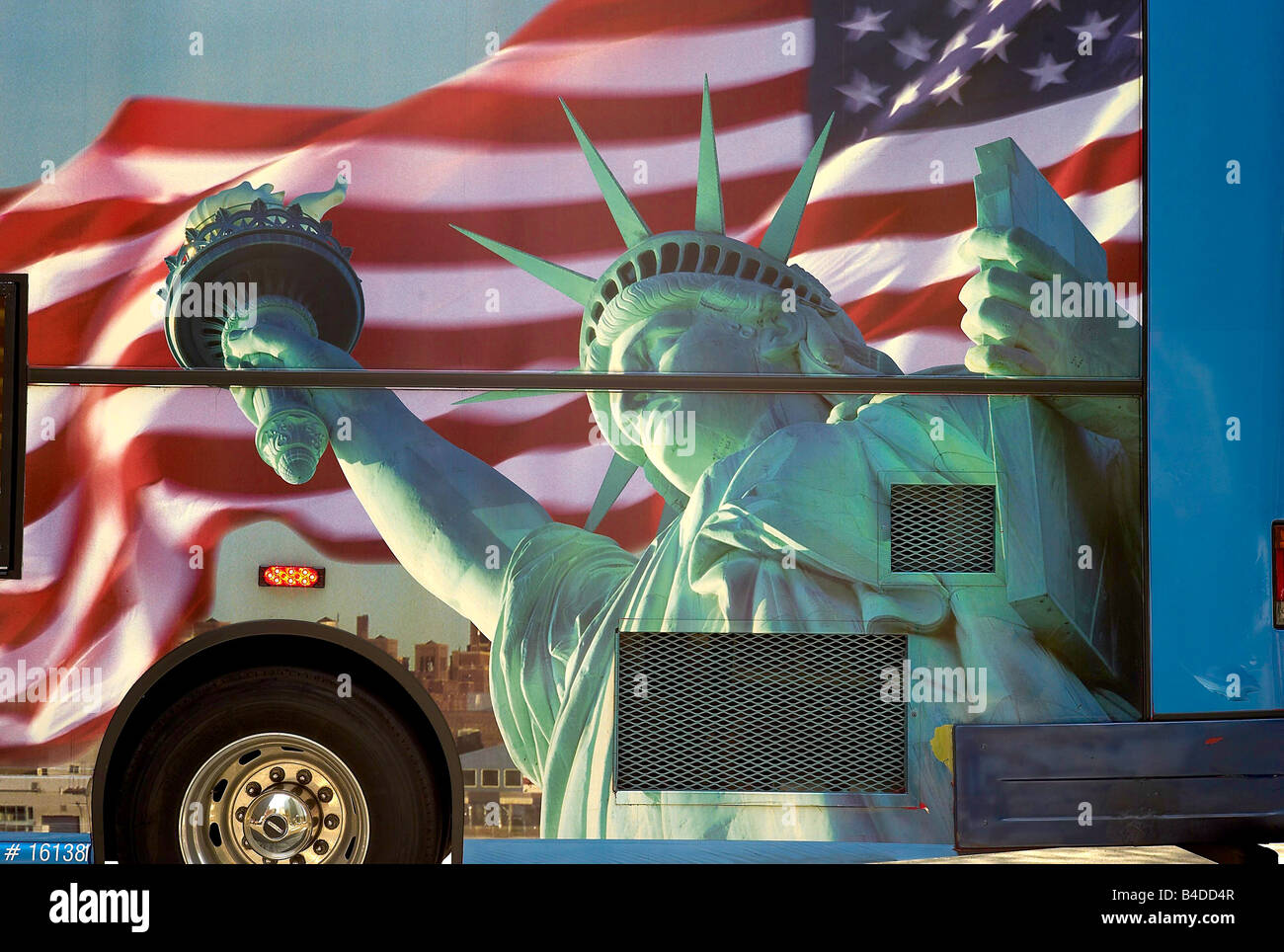 an image of the Statue of Liberty on the side of a bus in New York City