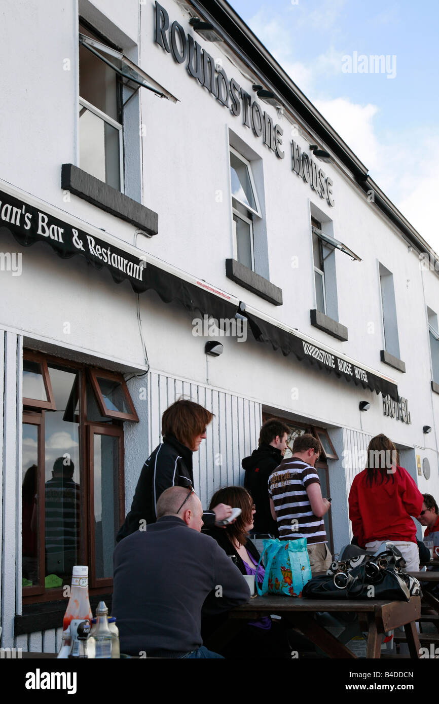 young people eating Roundstone House hotel Bar Restaurant pub outside