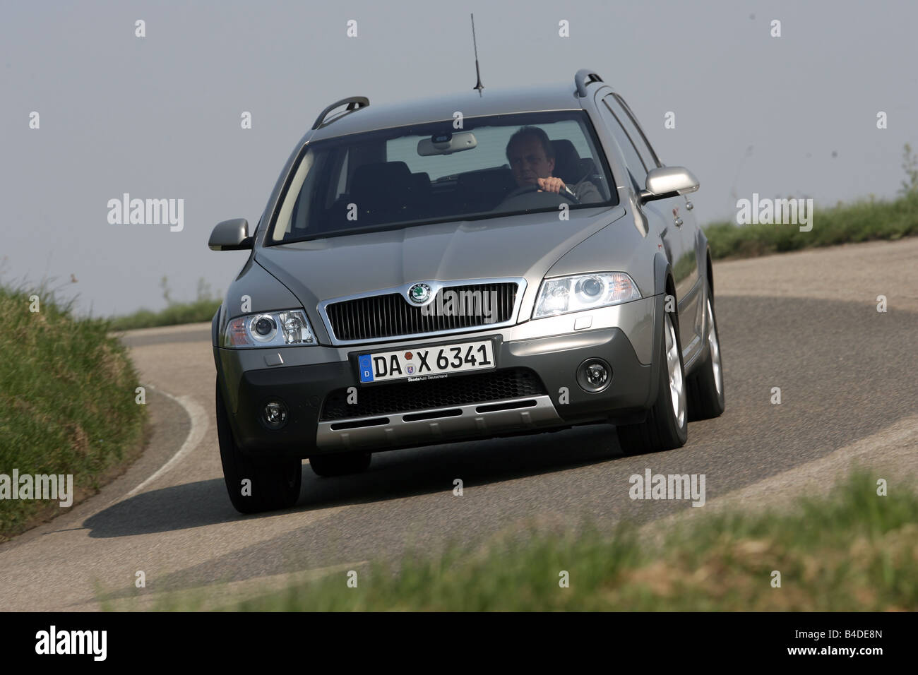 Skoda Octavia Combi Scout, model year 2007-, silver, driving, diagonal from the front, frontal view, country road Stock Photo
