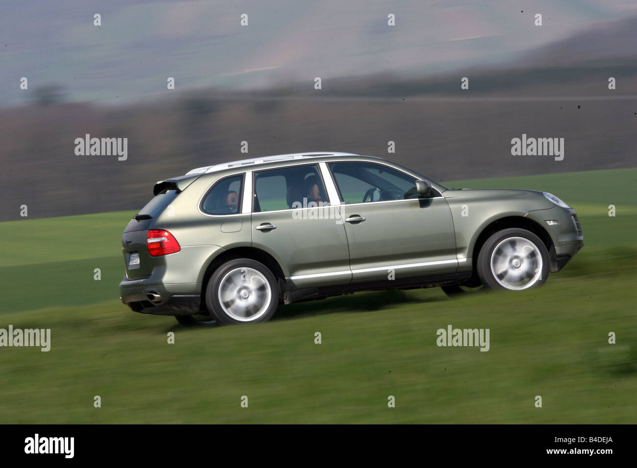 Porsche Cayenne, model year 2005, silver, driving, side view, country
