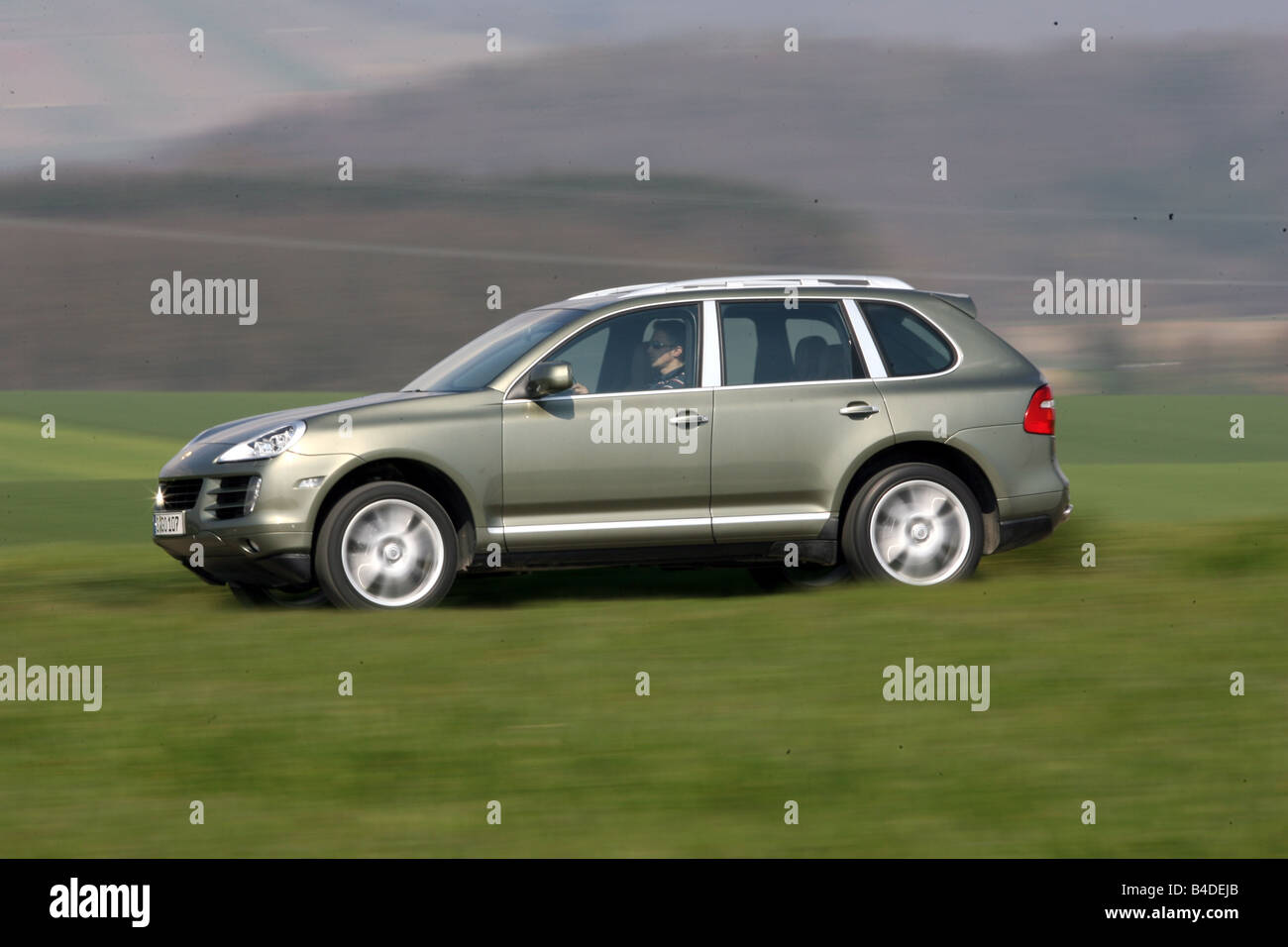 Porsche Cayenne, model year 2005, silver, driving, side view, country