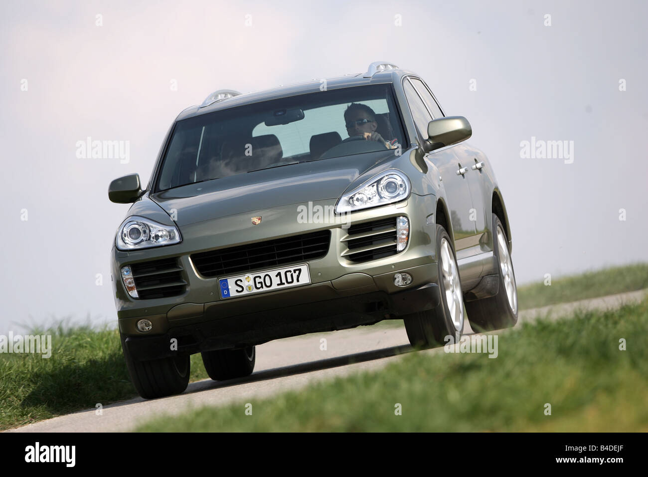 Porsche Cayenne, model year 2005, silver, driving, diagonal from the