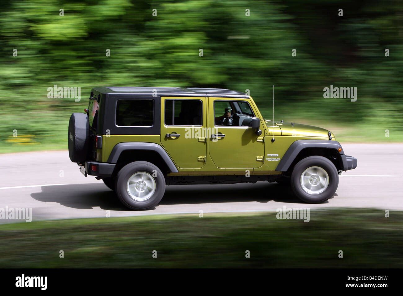 Jeep Wrangler Unlimited  CRD, model year 2007-, green-metallic, driving,  side view, country road Stock Photo - Alamy