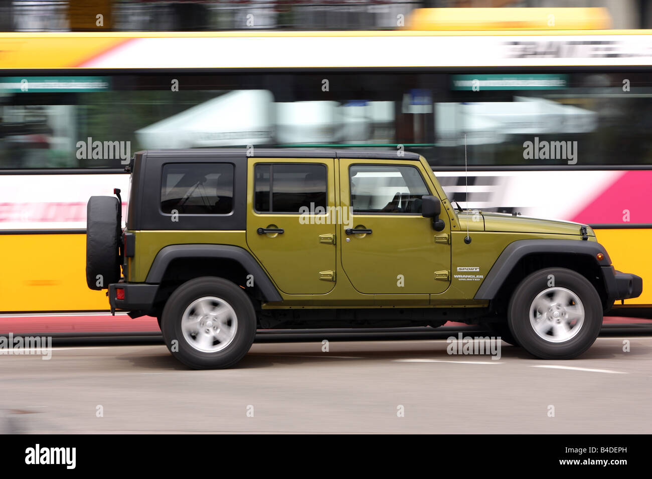 Jeep Wrangler Unlimited  CRD, model year 2007-, green-metallic, driving,  side view, City Stock Photo - Alamy