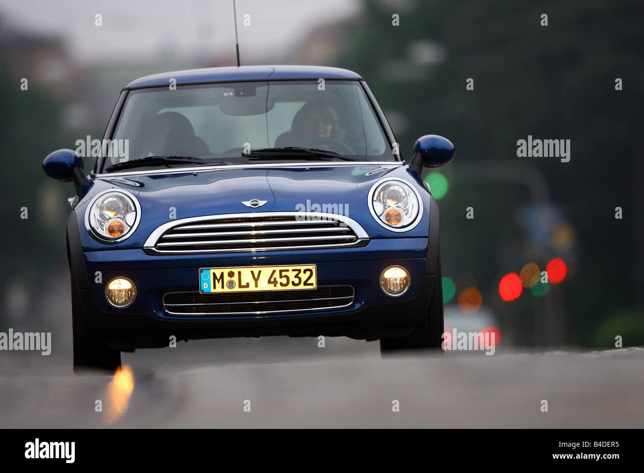 Mini One, model year 2007-, blue moving, frontal view, City Stock Photo