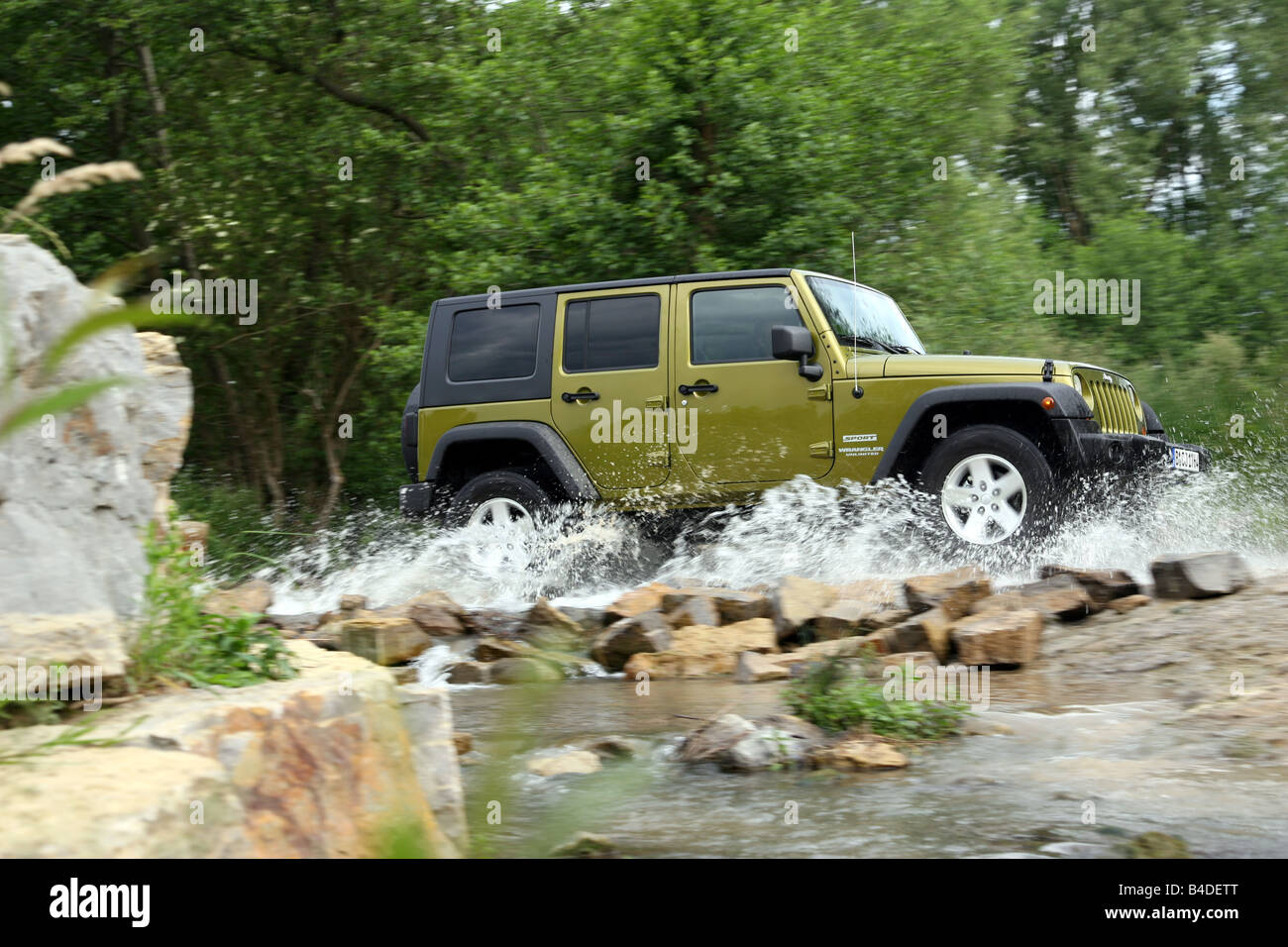 Jeep Wrangler Unlimited  CRD, model year 2007-, green-metallic, driving,  side view, offroad, Water Stock Photo - Alamy