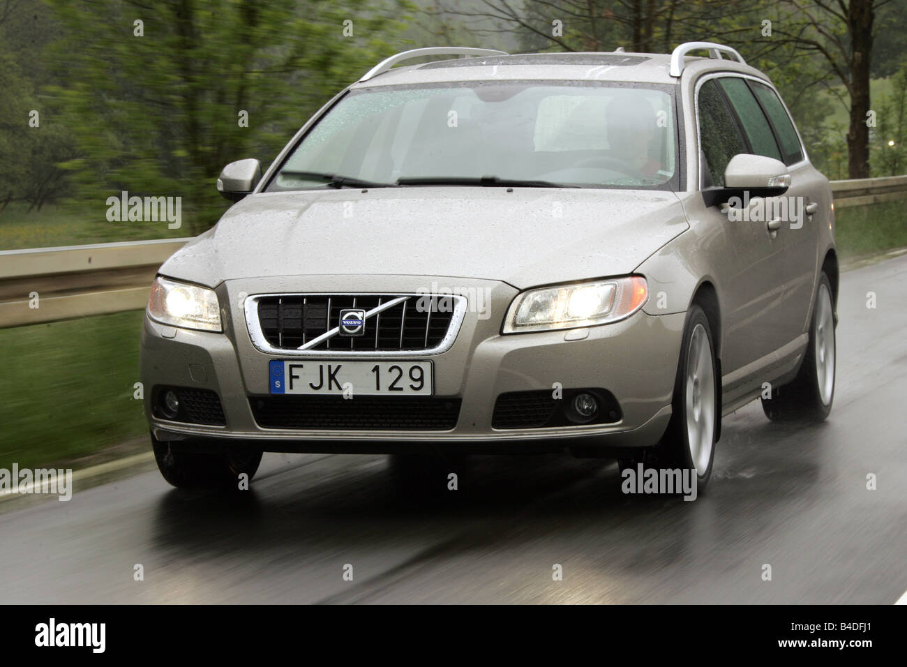 Volvo V70 T6 AWD, model year 2007-, driving, diagonal from the front, frontal view, side view, country road Stock Photo