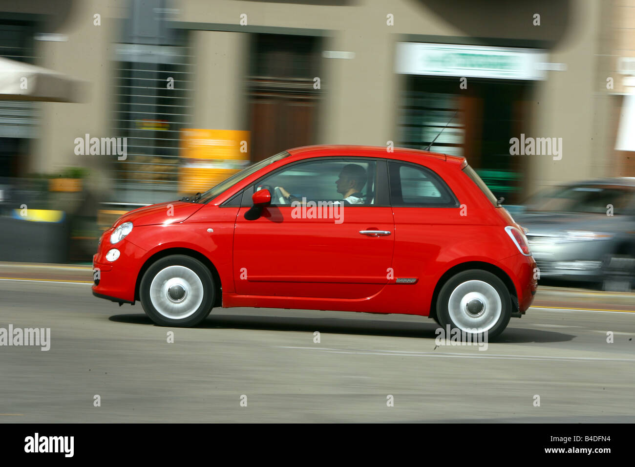 Fiat 500, model year 2007-, red, driving, side view, City Stock Photo