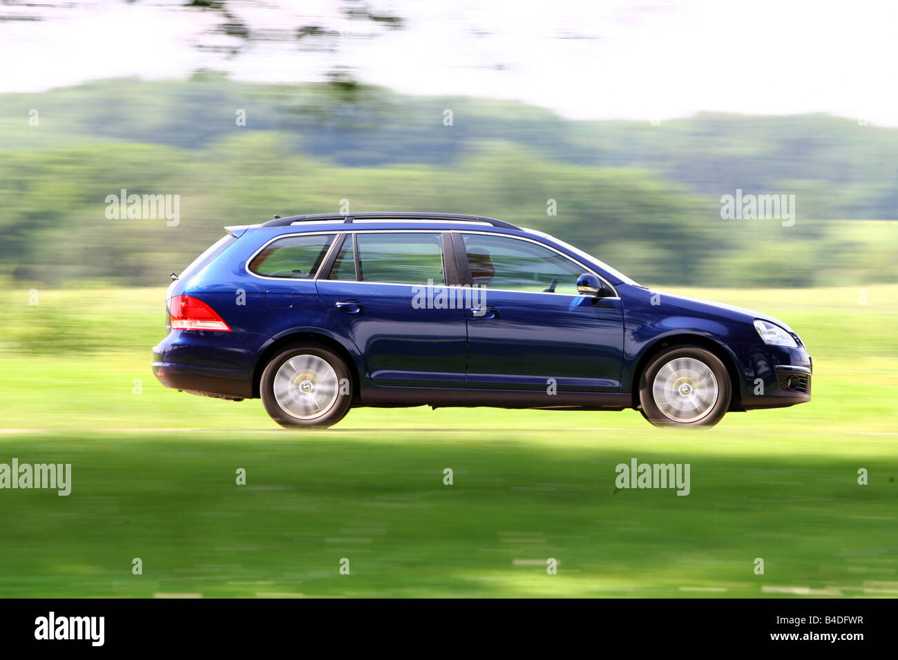 VW Volkswagen Golf Variant 1.9 TDI Comfortline, model year 2007-, blue  moving, side view, country road Stock Photo - Alamy