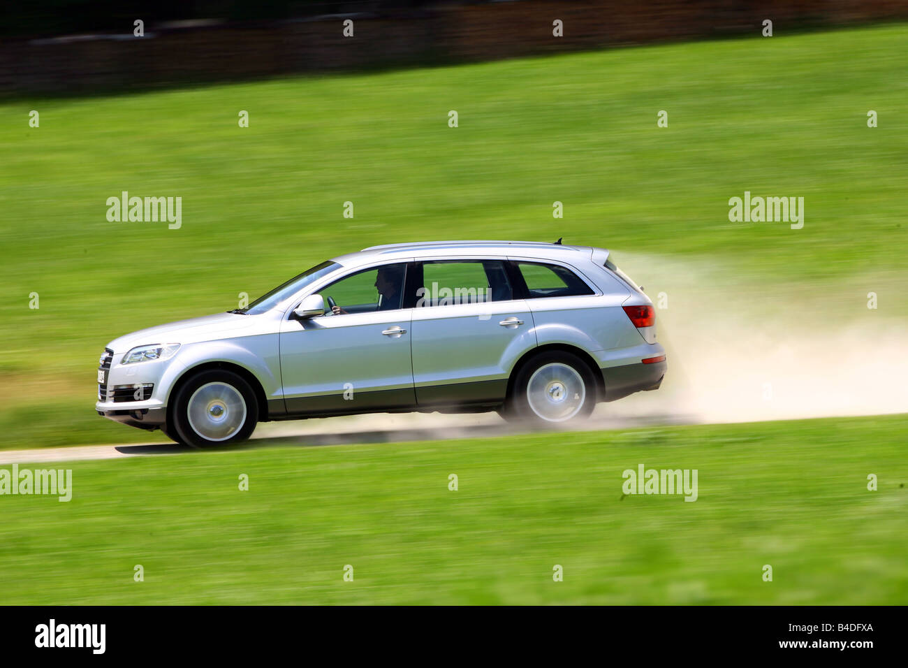 Audi Q7, model year 2007-, silver, driving, side view, country road Stock Photo