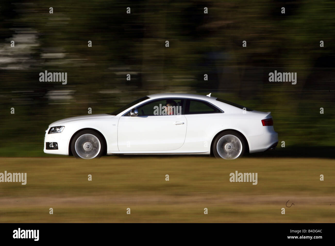 Audi S5, model year 2007-, white, driving, side view, country road Stock Photo