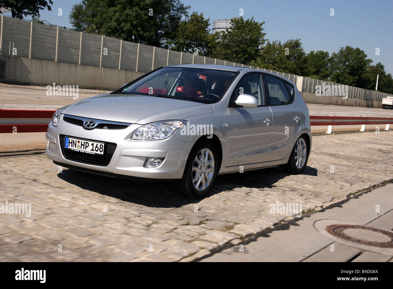 Hyandai i30 1.6 Style, model year 2007-, silver, driving, diagonal from the front, frontal view, test track Stock Photo