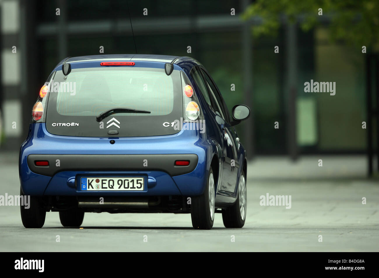 Citroen C1 HDi 55 Style, model year 2007-, blue moving, diagonal from the back, rear view, City Stock Photo