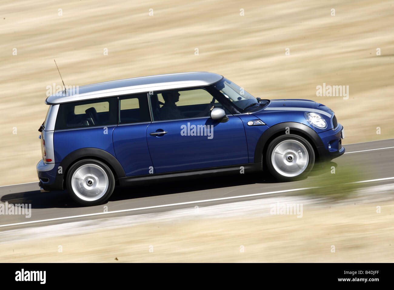 Mini Cooper S Clubman, model year 2007-, blue moving, side view, country road Stock Photo