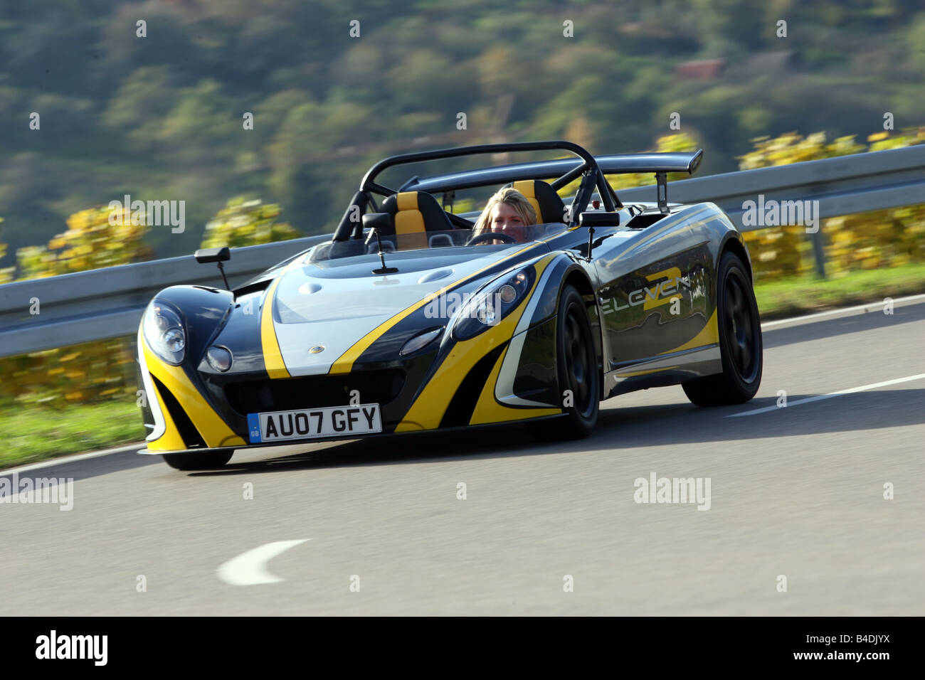 Lotus 2-Eleven, model year 2007-, black-yellow, driving, moving ... Lotus 2-Eleven, model year 2007-, black-yellow, driving, moving ...